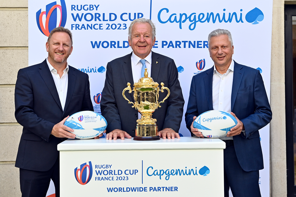 Alan Gilpin World Rugby CEO, Sir Bill Beaumont World Rugby Chairman and Aiman Ezzat Capgemini Group CEO pose in front of the Rugby World Cup trophy on September 06, 2021 in Paris, France.